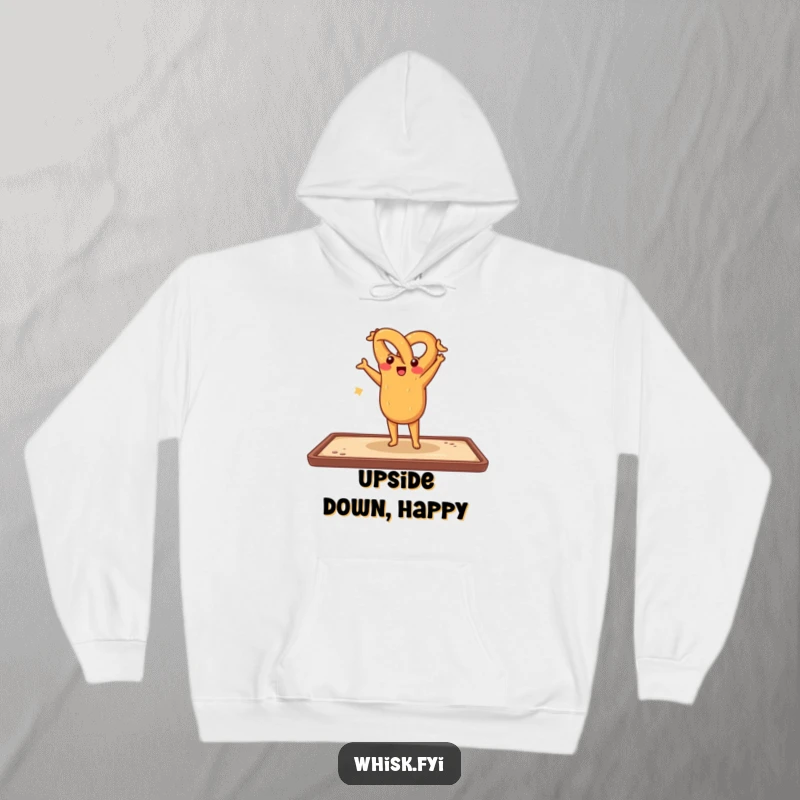 Funny hoodie featuring a cheerful pretzel doing a handstand on a baking sheet, offering cozy comfort with a playful, humorous bakery theme.