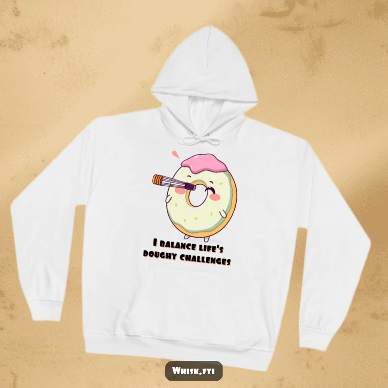 Funny donut character with a whisk on its nose, featured on a cozy hoodie. A delightful and warm gift for baking enthusiasts who appreciate humor.